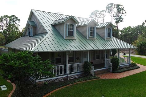 ranch house with green metal roof|ranch homes by morton.